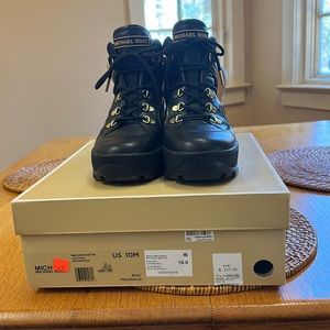 Michael Kors leather black boots with gold details excellent condition.